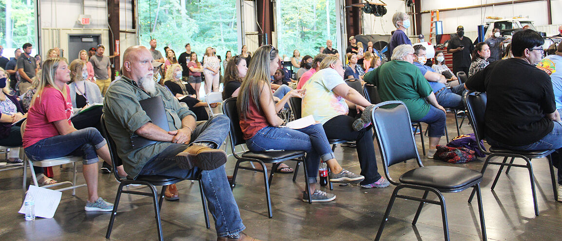 Large crowd confronts county school board about masks